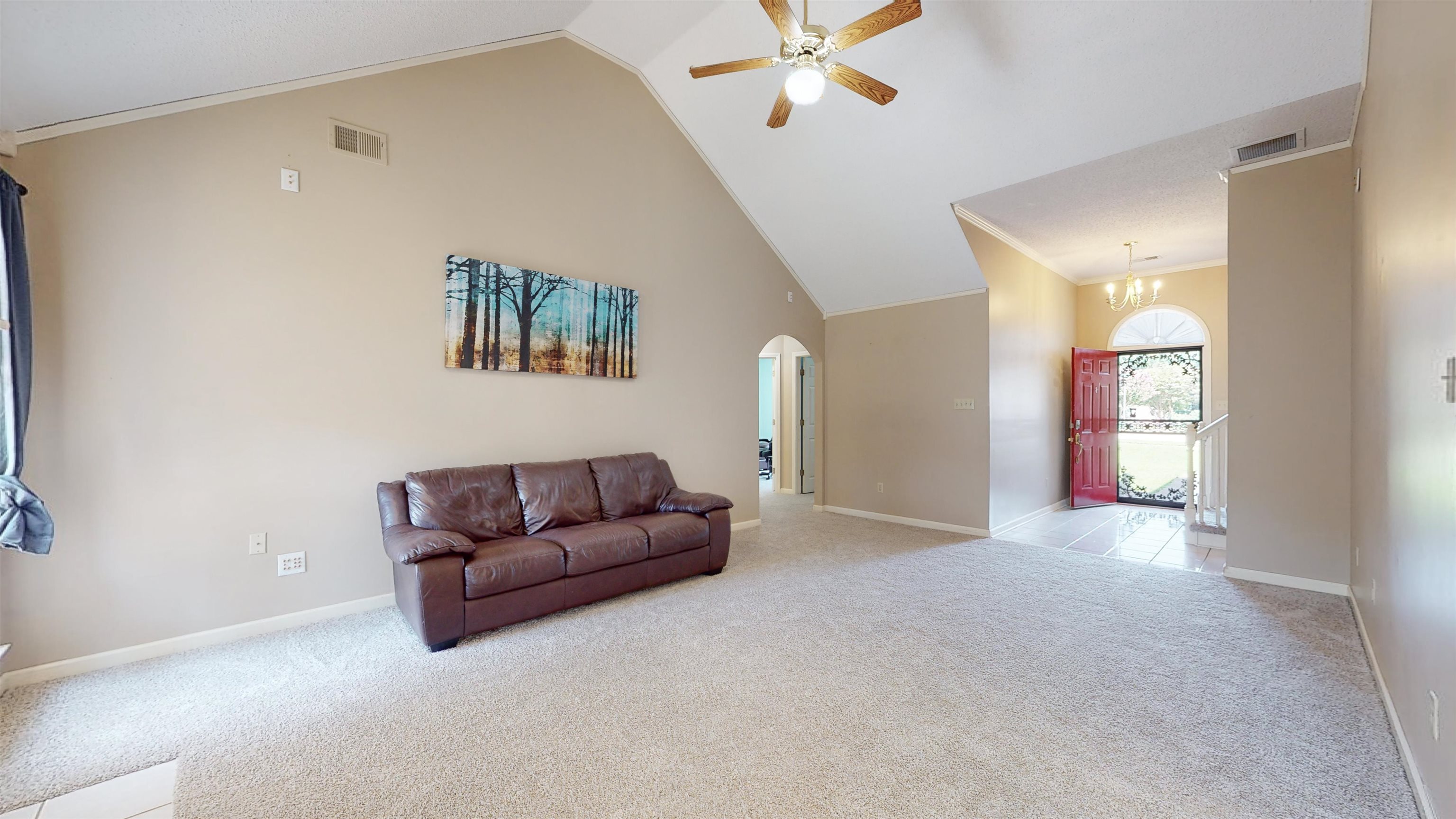 195 Cross Point Drive Collierville, TN 38017 - Photo 15 of 40 a living room with furniture and a chandelier