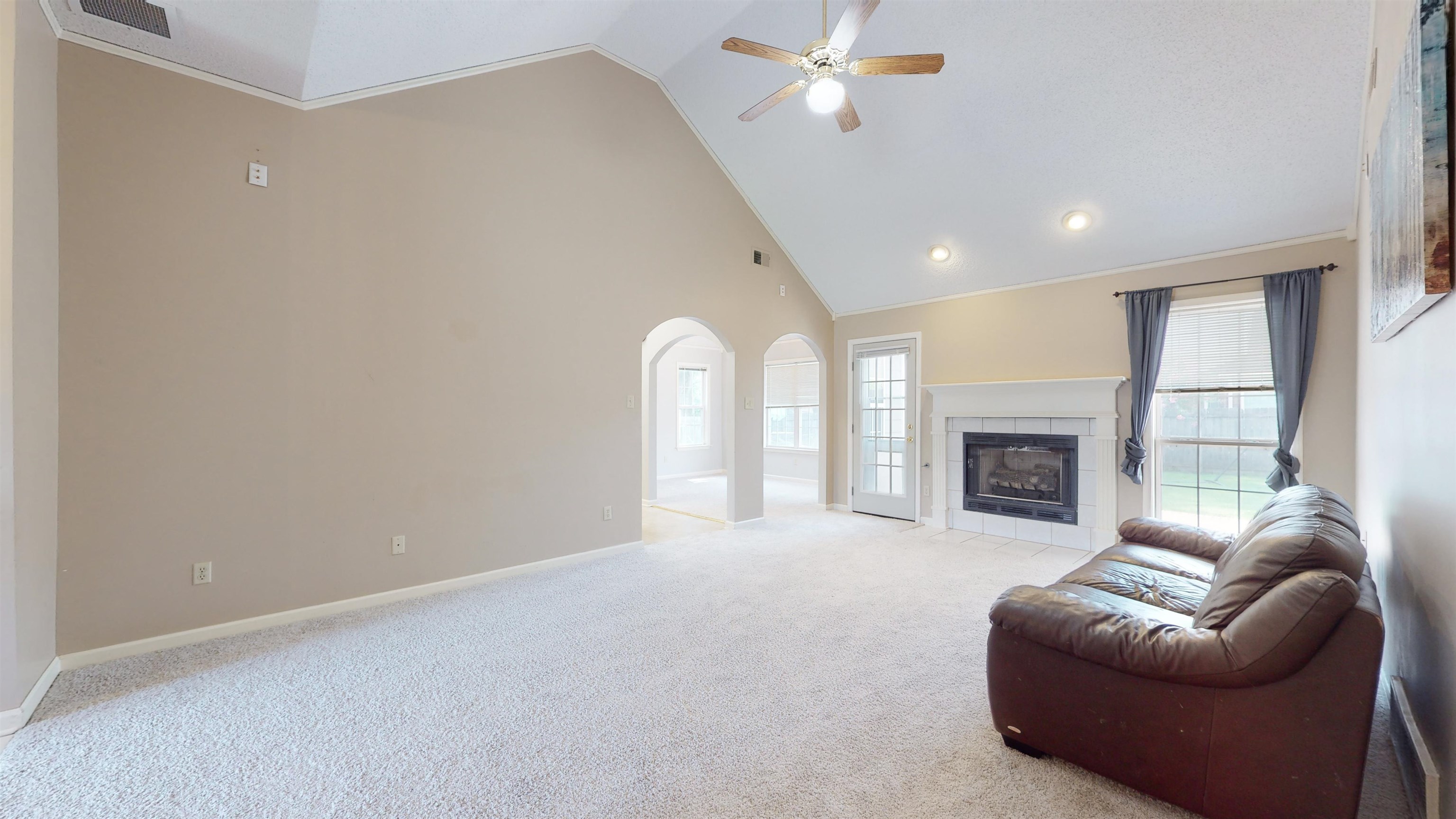 195 Cross Point Drive Collierville, TN 38017 - Photo 17 of 40 a living room with furniture and a fireplace
