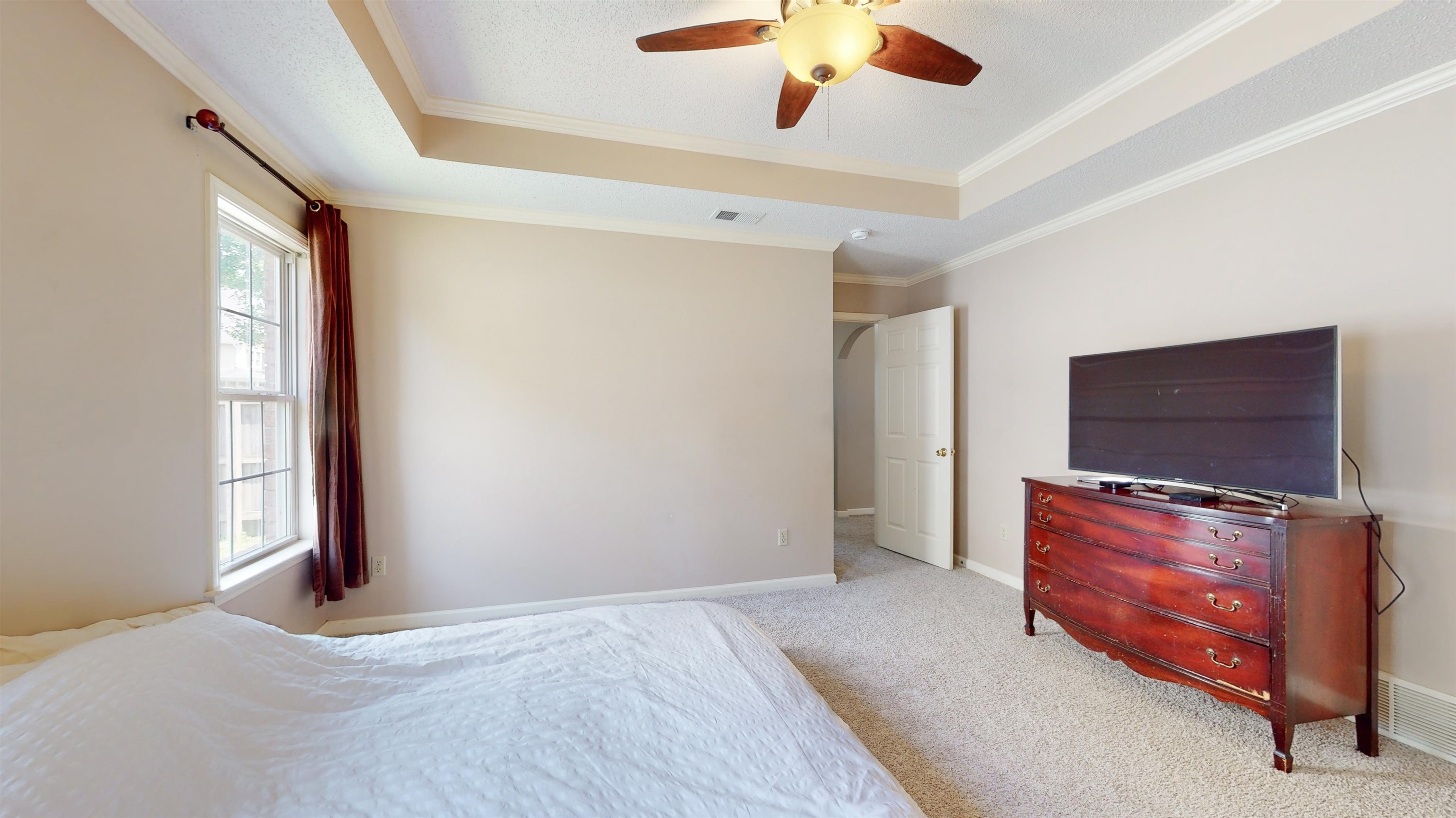 195 Cross Point Drive Collierville, TN 38017 - Photo 20 of 40 a bedroom with furniture and flat screen tv