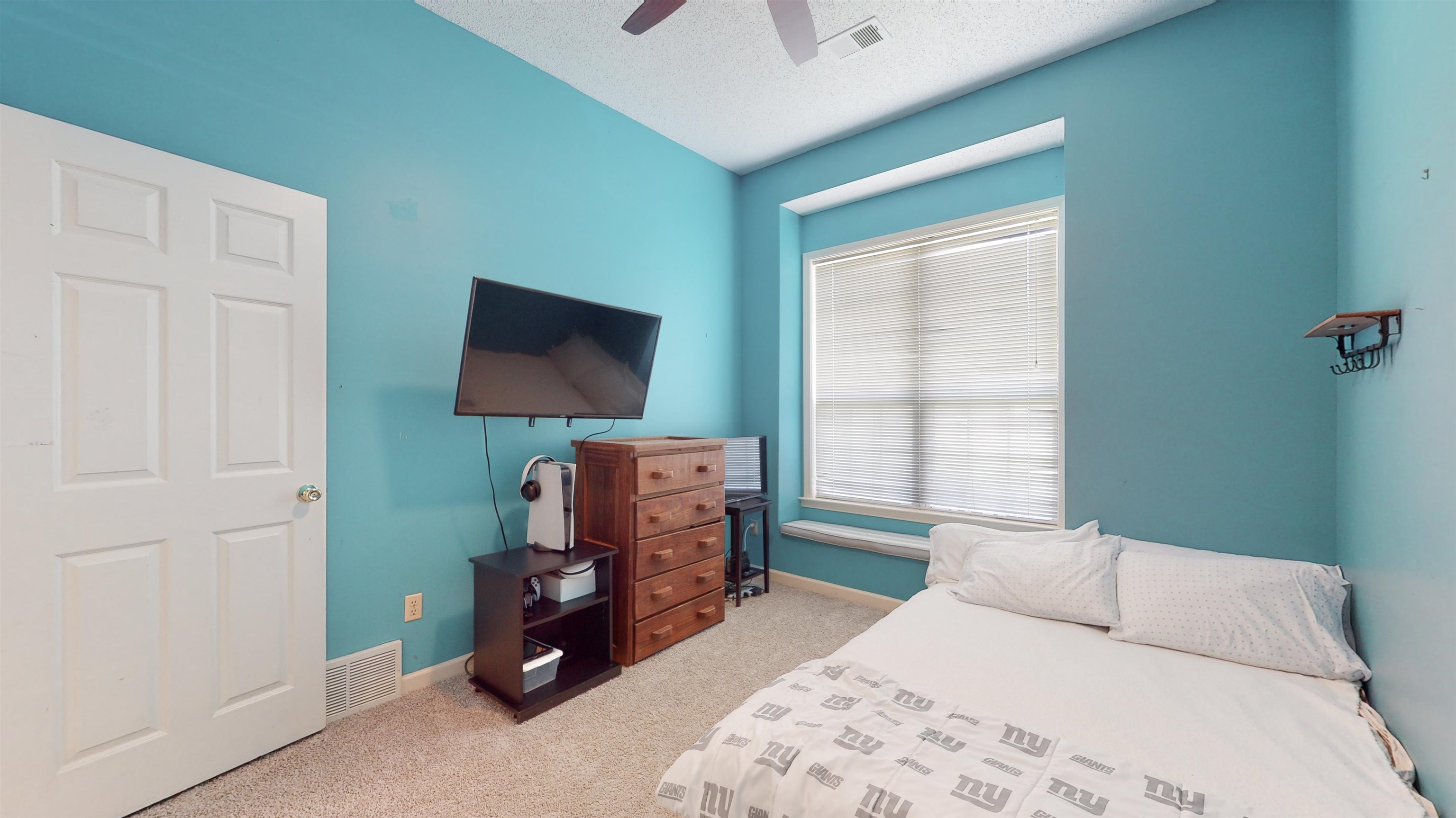 195 Cross Point Drive Collierville, TN 38017 - Photo 24 of 40 a bedroom with a bed and a flat tv screen