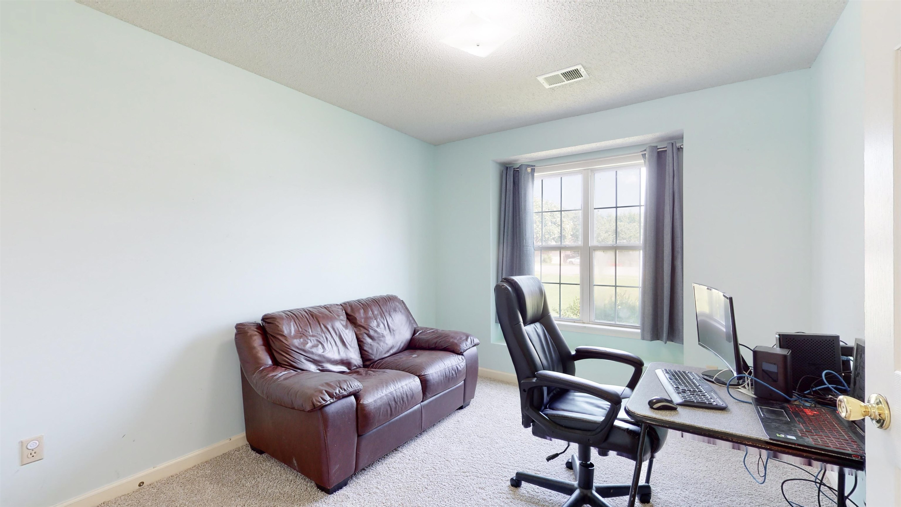 195 Cross Point Drive Collierville, TN 38017 - Photo 28 of 40 a living room with furniture a flat screen tv and a window
