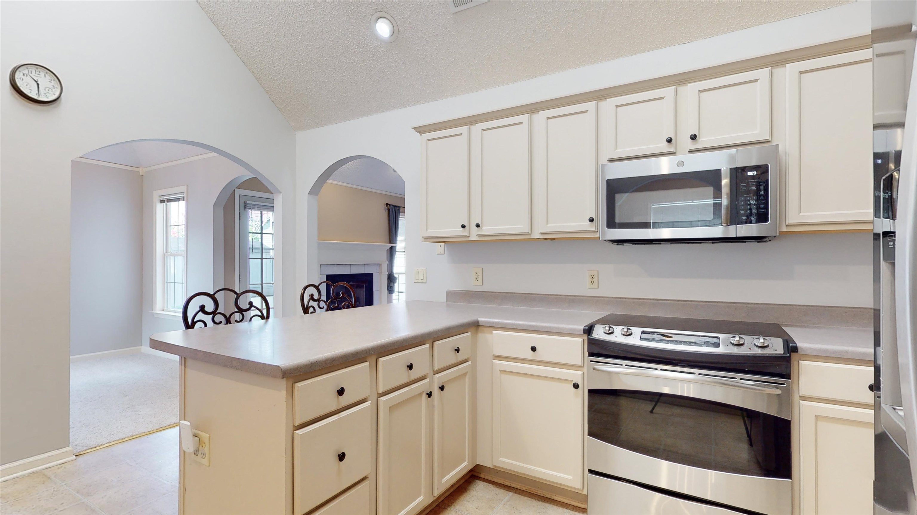 195 Cross Point Drive Collierville, TN 38017 - Photo 5 of 40 a kitchen with stainless steel appliances granite countertop white cabinets a sink and dishwasher