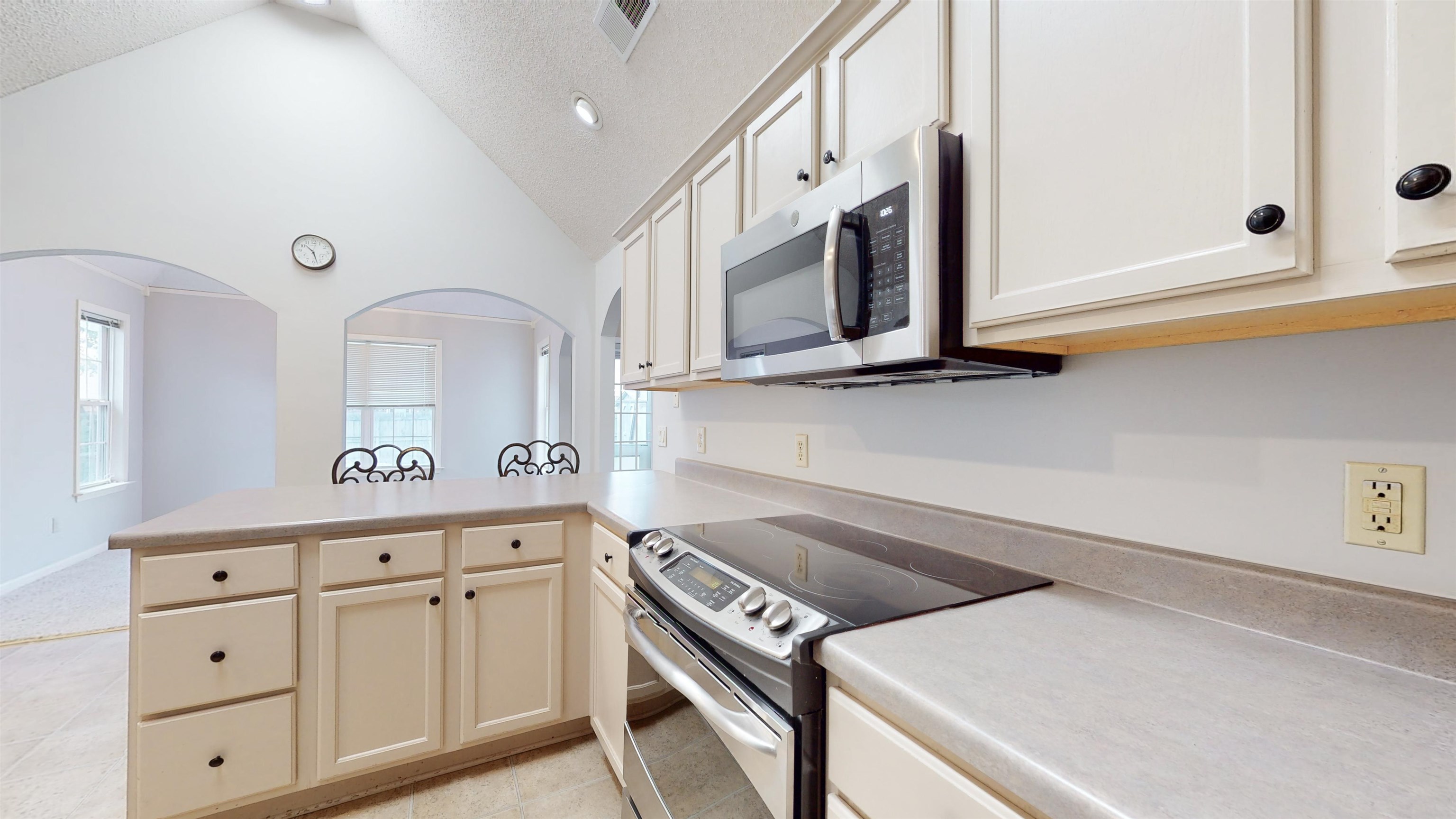 195 Cross Point Drive Collierville, TN 38017 - Photo 6 of 40 a kitchen with white cabinets and white appliances