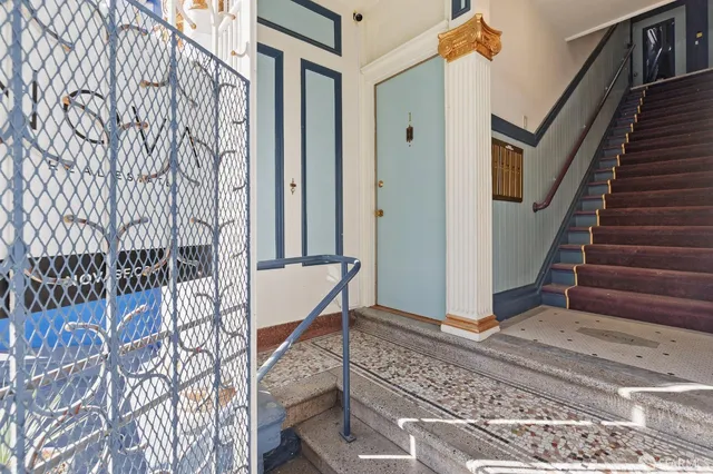 a view of entryway with wooden floor