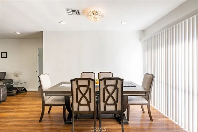 a kitchen with stainless steel appliances a refrigerator sink and cabinets