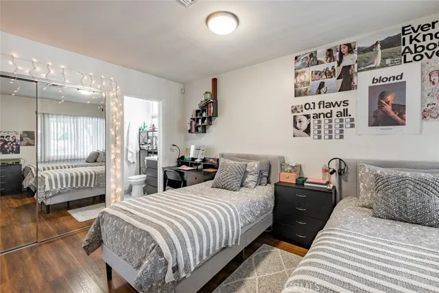 a bathroom with a sink mirror vanity and toilet
