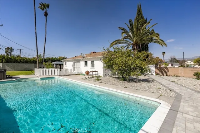a view of a dining room with furniture and window
