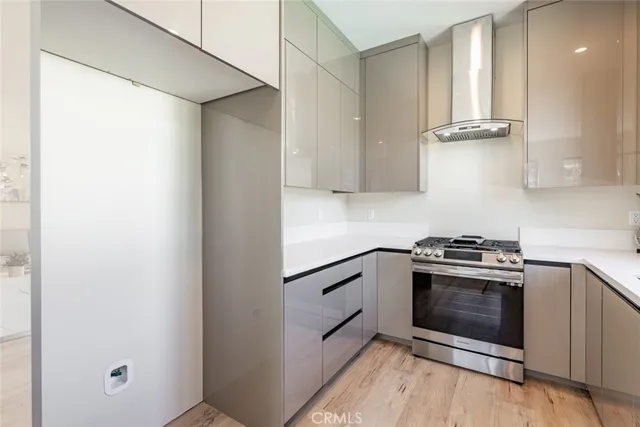 a bedroom with a bed and a potted plant