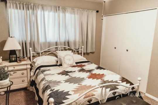 428 Peg Street Ridgecrest, CA 93555 - Photo 23 of 29 a bedroom with a bed and a window