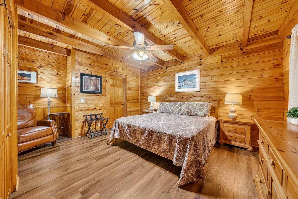 149 Mountain Springs Road Warm Springs, GA 31830 - Photo 18 of 43 a bedroom with a bed and wooden floor