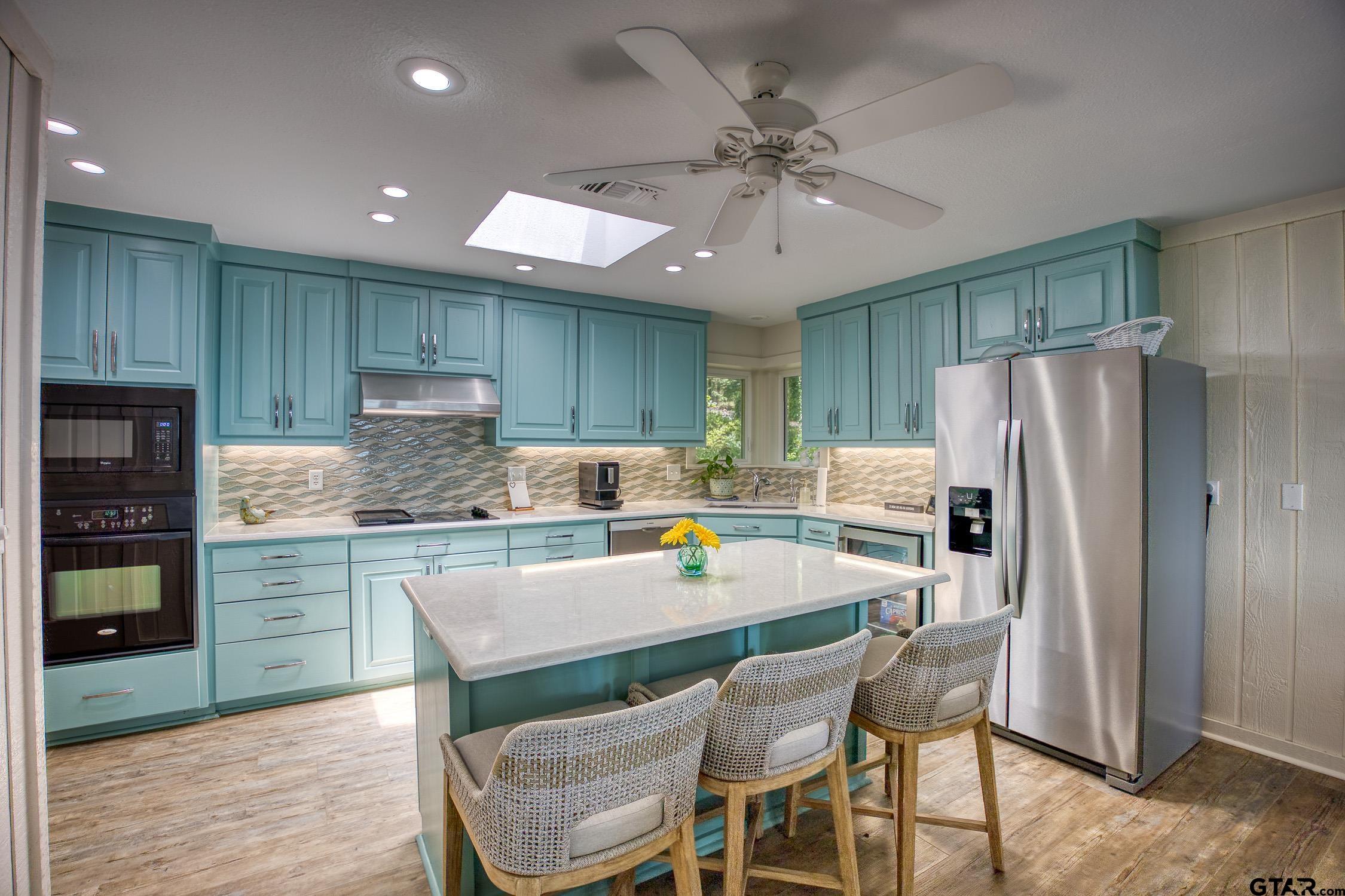 17553 Sleepy Hollow Way Flint, TX 75762 - Photo 13 of 41 a kitchen with granite countertop stainless steel appliances a refrigerator and a stove top oven