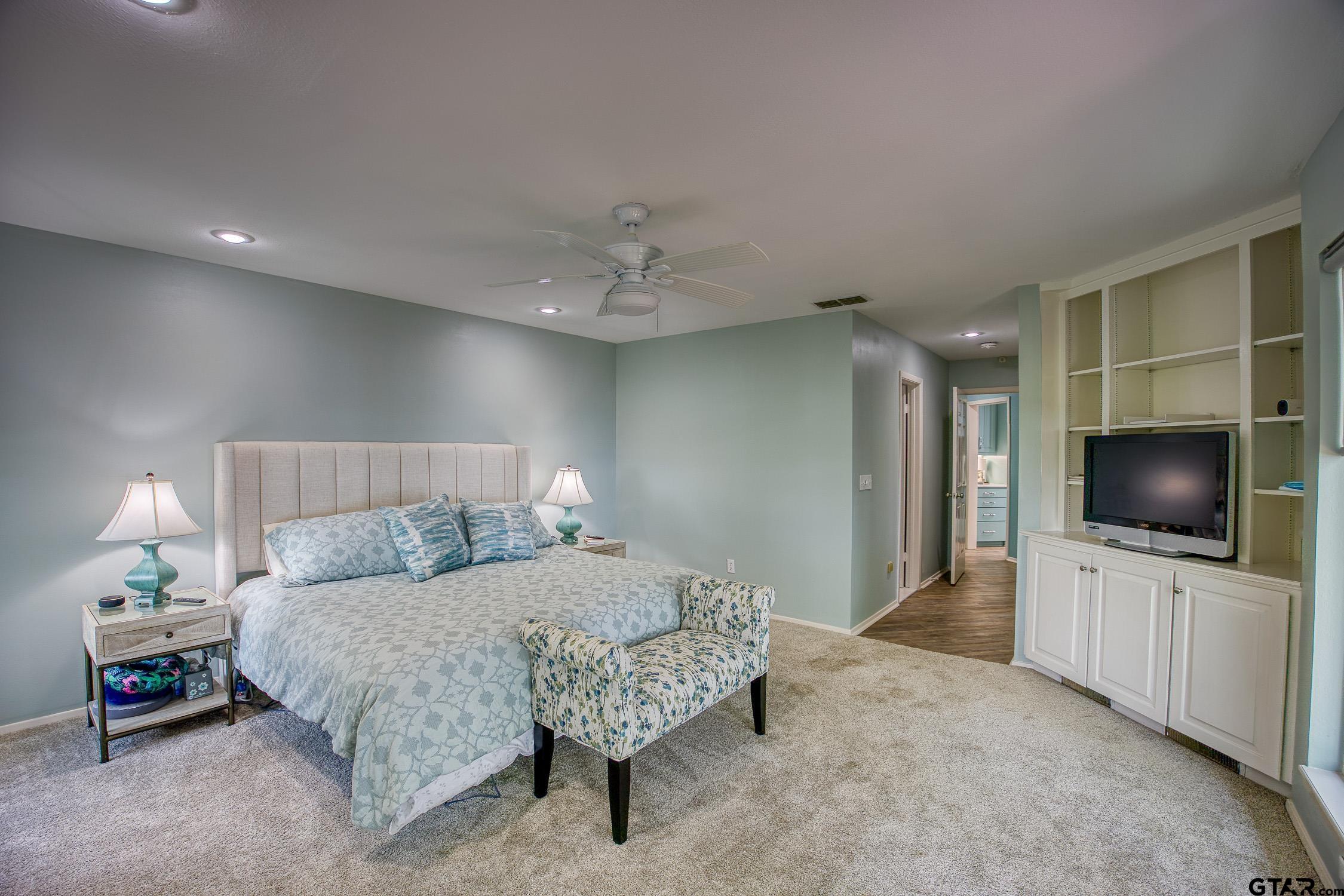 17553 Sleepy Hollow Way Flint, TX 75762 - Photo 17 of 41 a bedroom with a bed and a flat screen tv