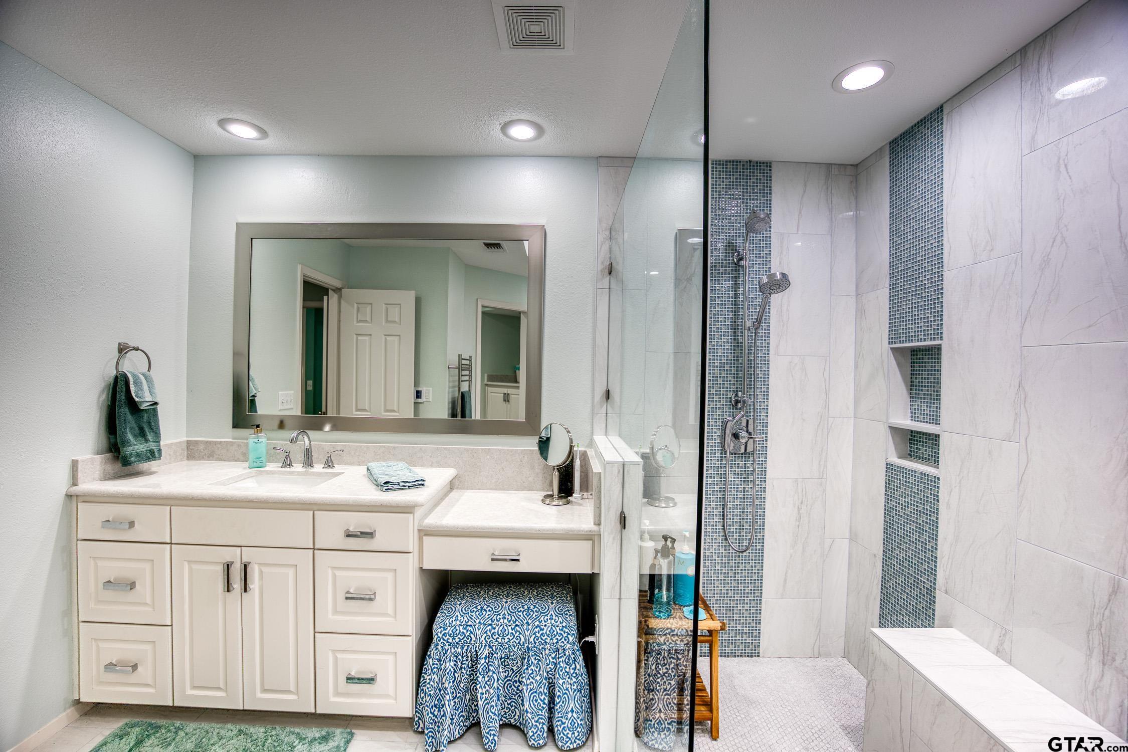 17553 Sleepy Hollow Way Flint, TX 75762 - Photo 20 of 41 a bathroom with a double vanity sink mirror and double