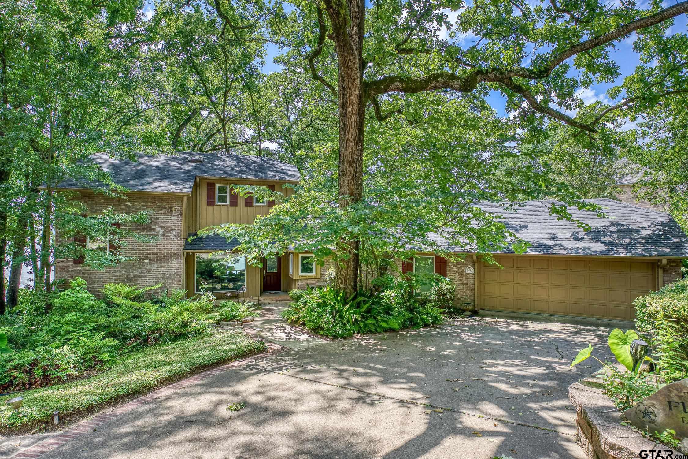 17553 Sleepy Hollow Way Flint, TX 75762 - Photo 2 of 41 a front view of a house with a garden and a tree