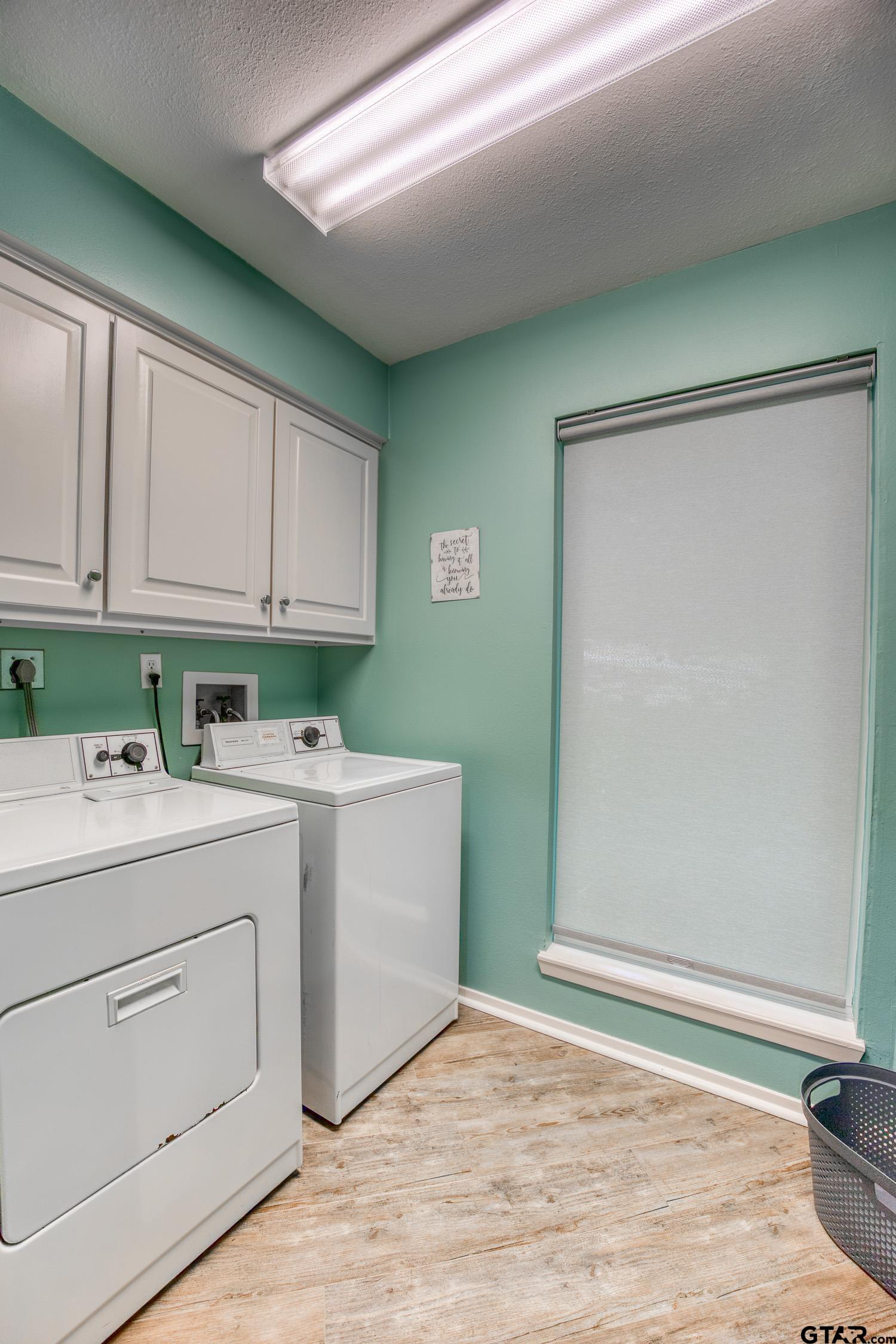 17553 Sleepy Hollow Way Flint, TX 75762 - Photo 21 of 41 a view of a kitchen with white cabinets and white appliances