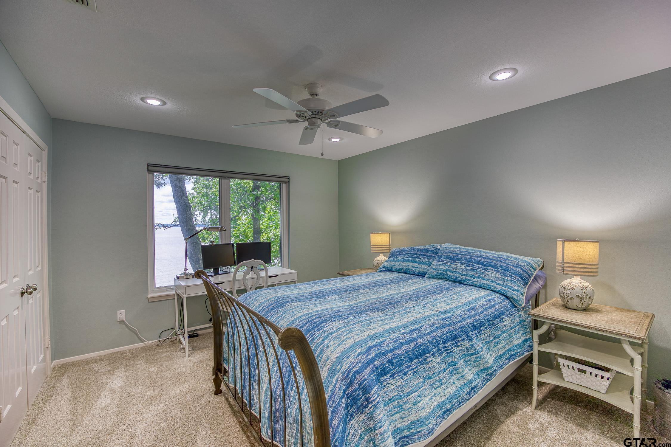 17553 Sleepy Hollow Way Flint, TX 75762 - Photo 27 of 41 a bedroom with a bed and a window