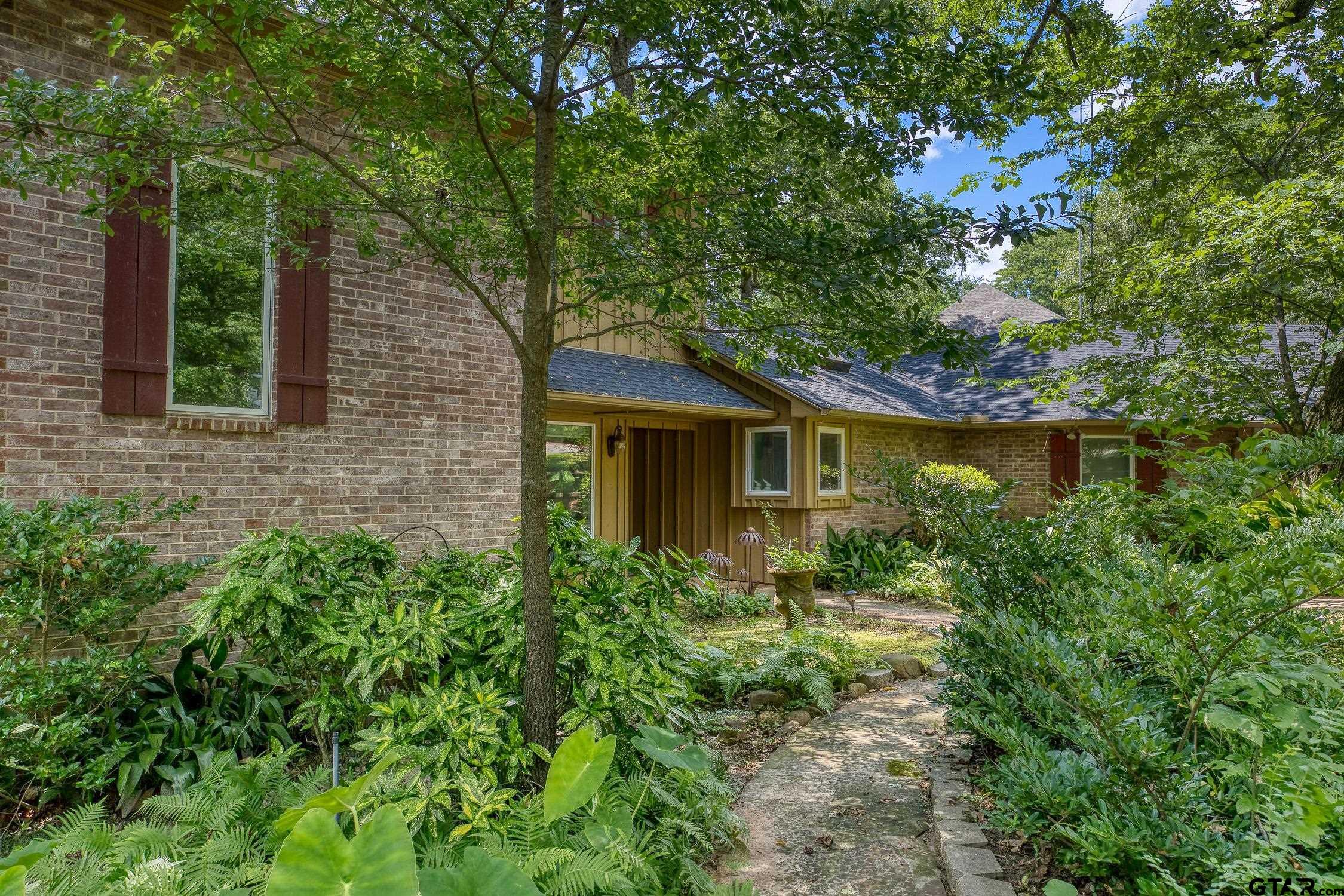 17553 Sleepy Hollow Way Flint, TX 75762 - Photo 3 of 41 a front view of a house with garden