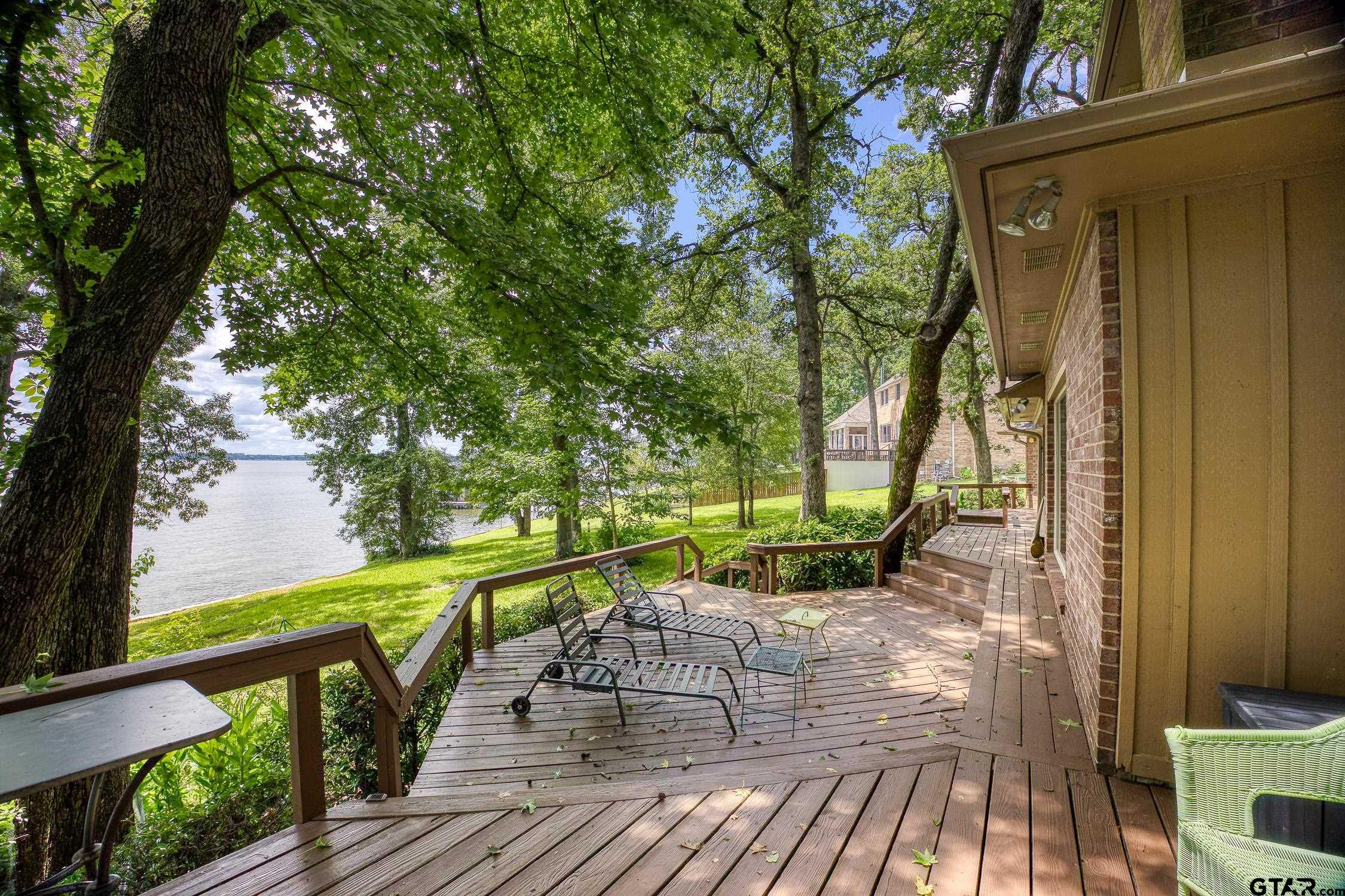 17553 Sleepy Hollow Way Flint, TX 75762 - Photo 35 of 41 a view of balcony with wooden floor and outdoor seating