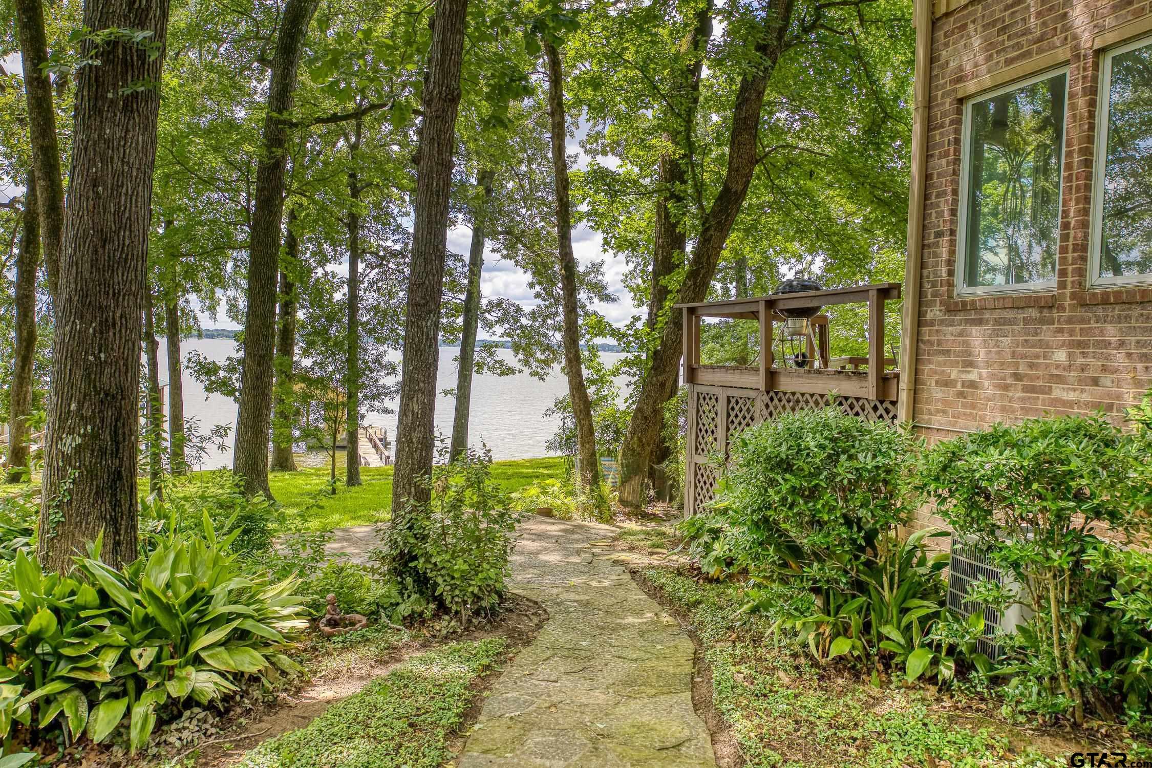 17553 Sleepy Hollow Way Flint, TX 75762 - Photo 39 of 41 a backyard of a house with lots of green space