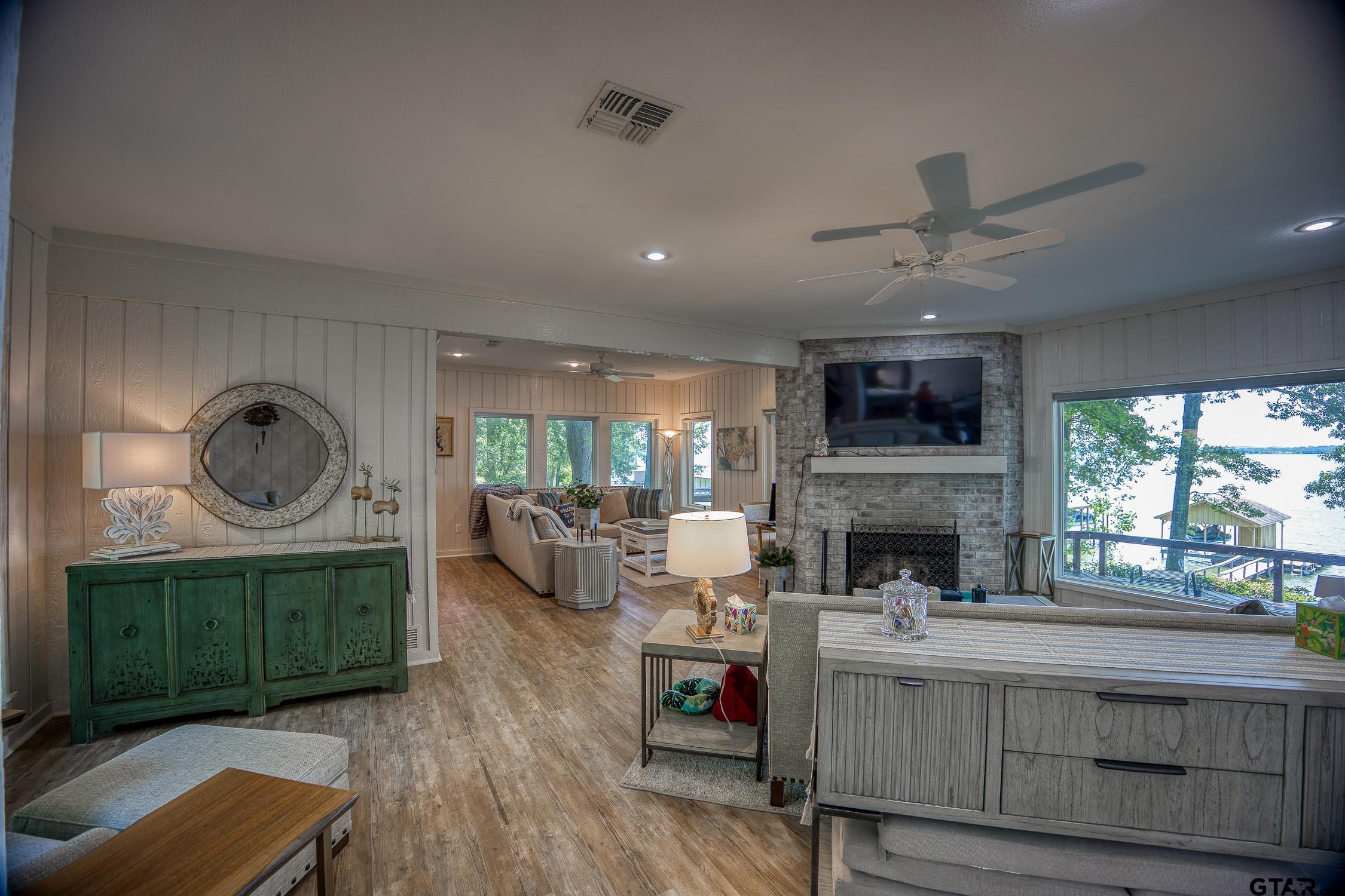 17553 Sleepy Hollow Way Flint, TX 75762 - Photo 4 of 41 a living room with fireplace furniture and a large window