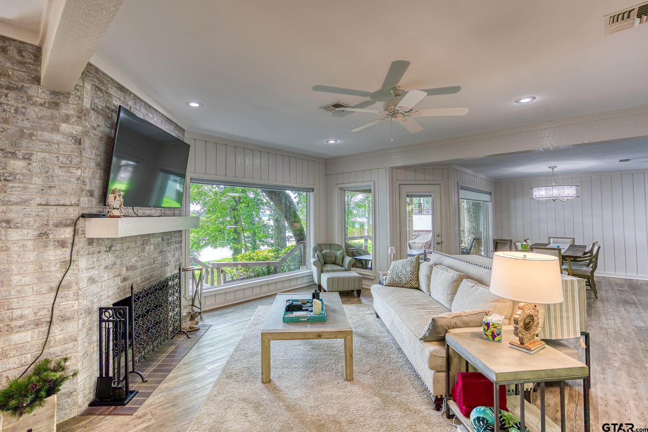 17553 Sleepy Hollow Way Flint, TX 75762 - Photo 5 of 41 a living room with furniture fireplace and a large window