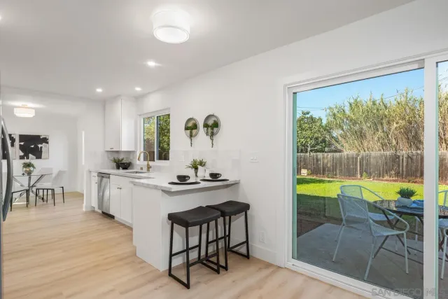 a kitchen with a table and chairs
