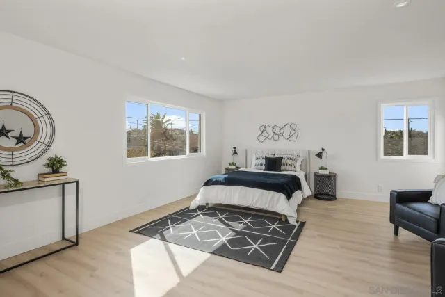 a bedroom with a bed and window