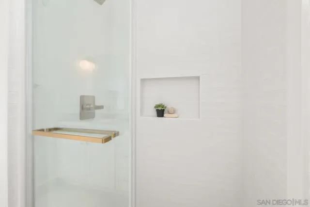 a picture of a bathroom with a shower