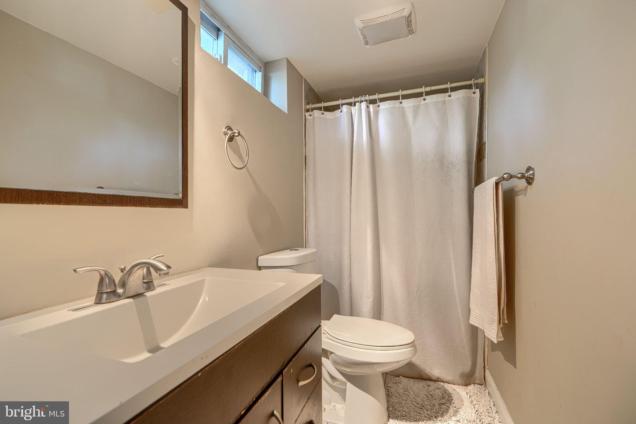 3708 Cassen Road Randallstown, MD 21133 - Photo 31 of 38 a bathroom with a sink toilet and shower