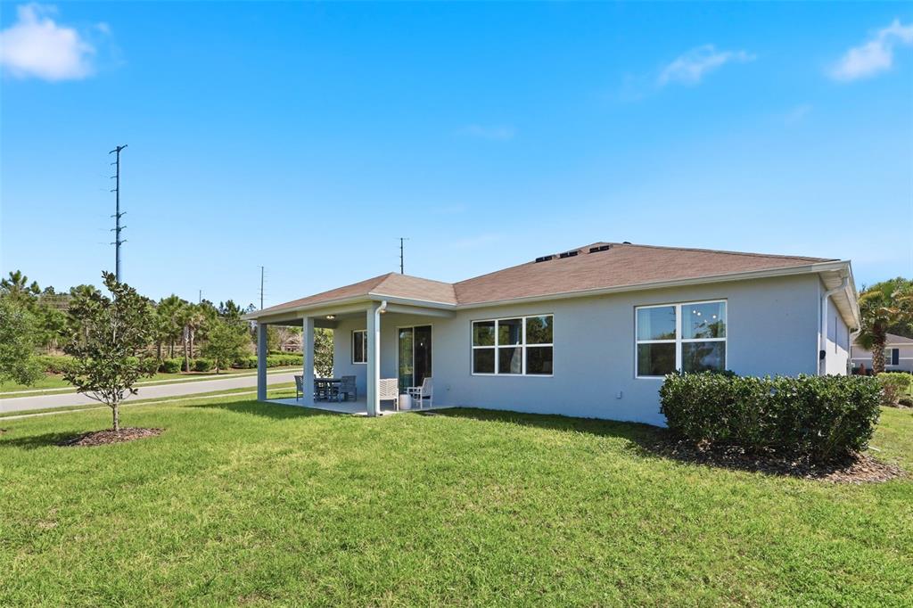 740 Rioja Drive Minneola, FL 34715 - Photo 28 of 33 a front view of house with yard and green space