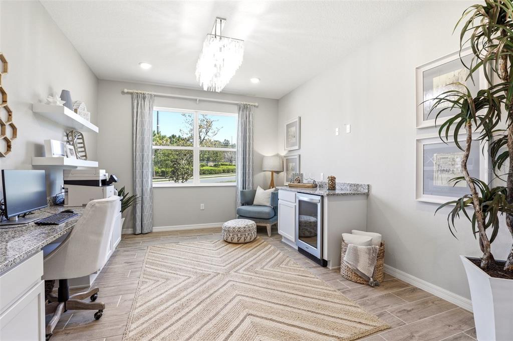 740 Rioja Drive Minneola, FL 34715 - Photo 9 of 33 a bedroom with furniture and a window