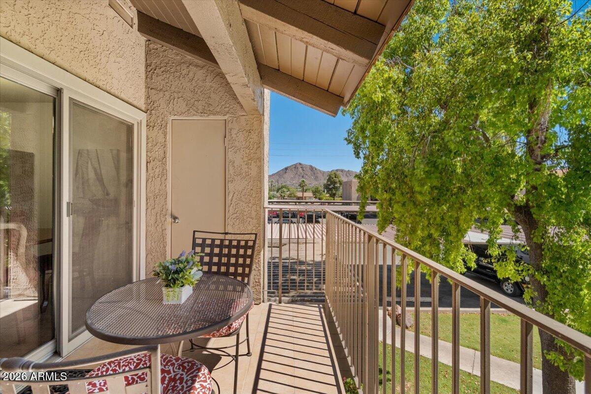 5525 East Thomas Road, Unit O12 Phoenix, AZ 85018 - Photo 13 of 27 a view of balcony with wooden floor and outdoor seating