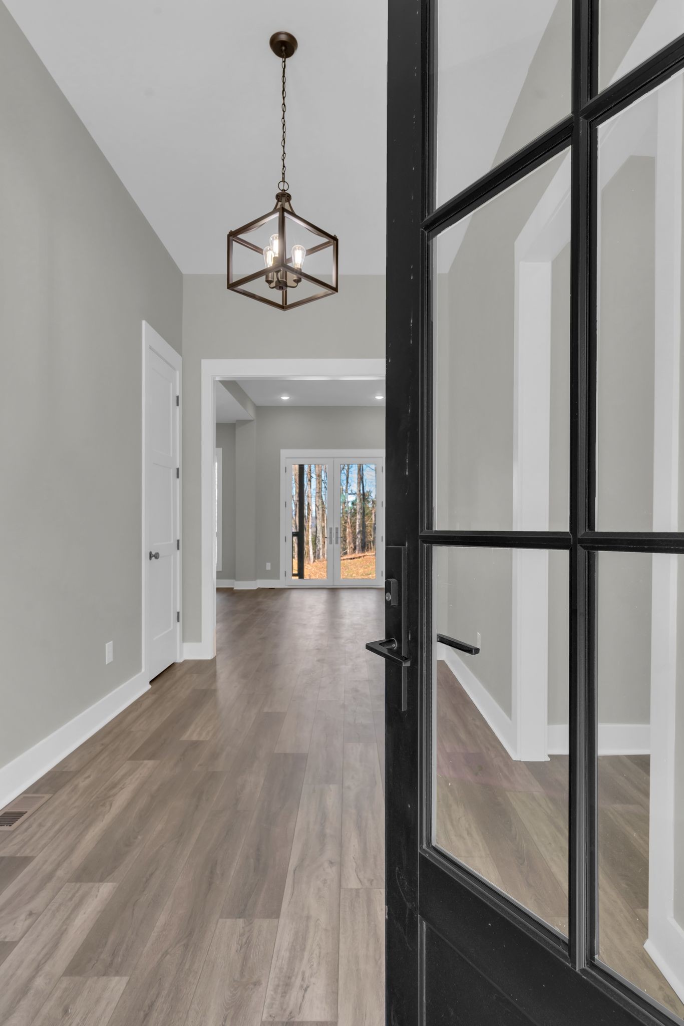 2165 Trammel Lane Lebanon, TN 37090 - Photo 3 of 81 a view of a hallway with wooden floor and staircase