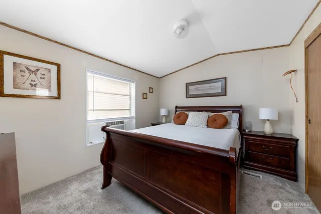 a bed room with a bed and a window