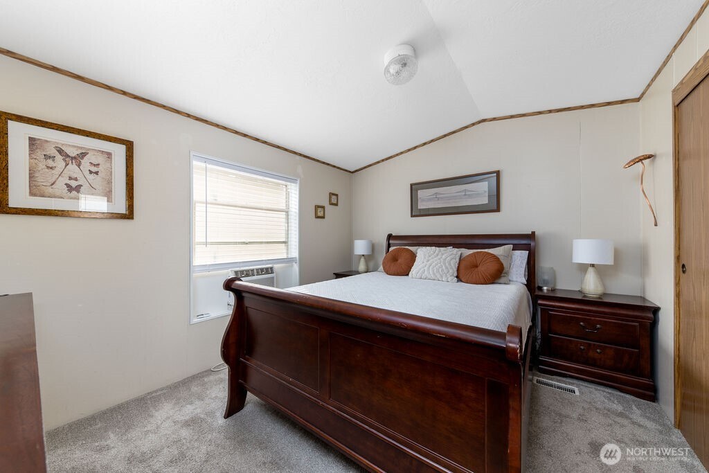 43010 Southeast North Bend Way, Unit 53 North Bend, WA 98045 - Photo 11 of 19 a bed room with a bed and a window