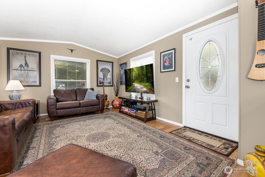43010 Southeast North Bend Way, Unit 53 North Bend, WA 98045 - Photo 3 of 19 a living room with furniture and a flat screen tv