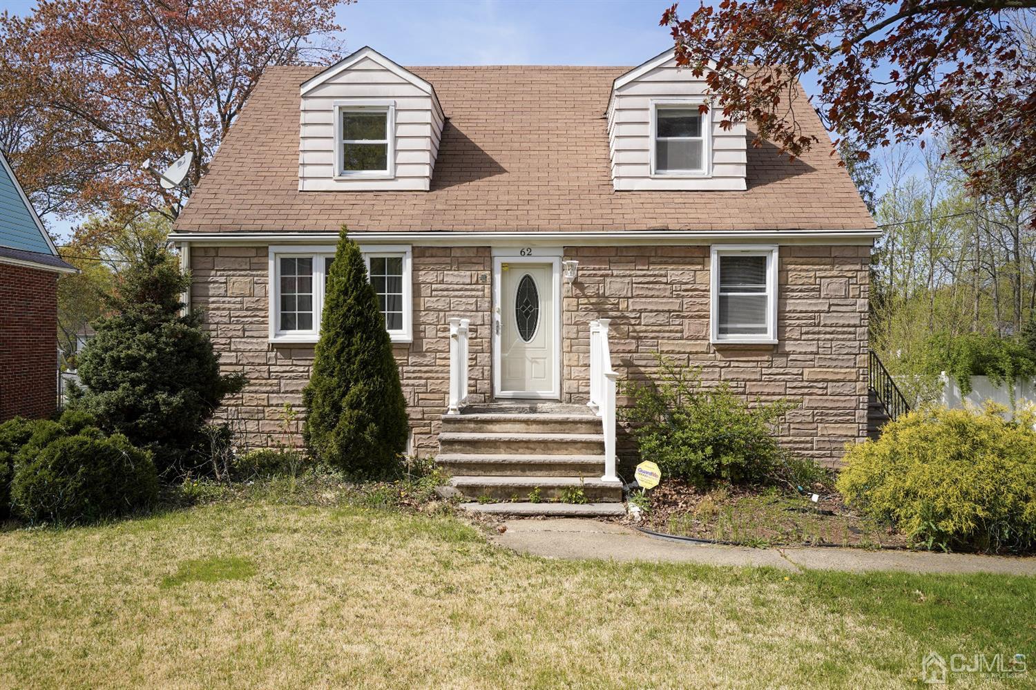 62 Oxford Road Colonia, NJ 07067 - Photo 1 of 10 a front view of a house with a yard