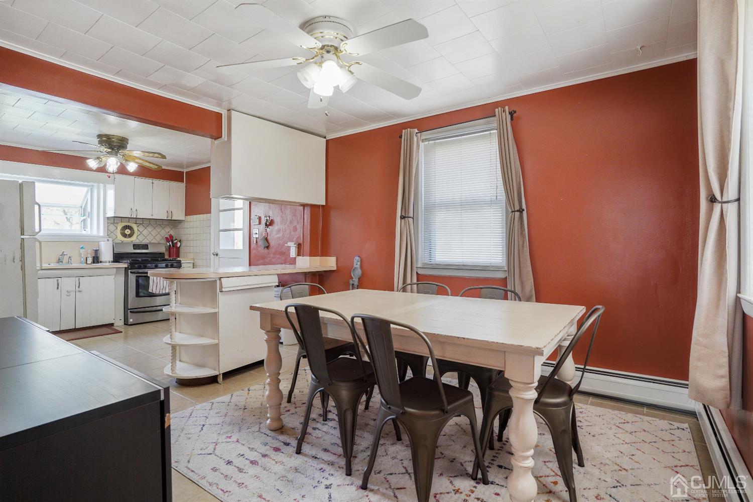 62 Oxford Road Colonia, NJ 07067 - Photo 4 of 10 a view of a dining room with furniture window and wooden floor