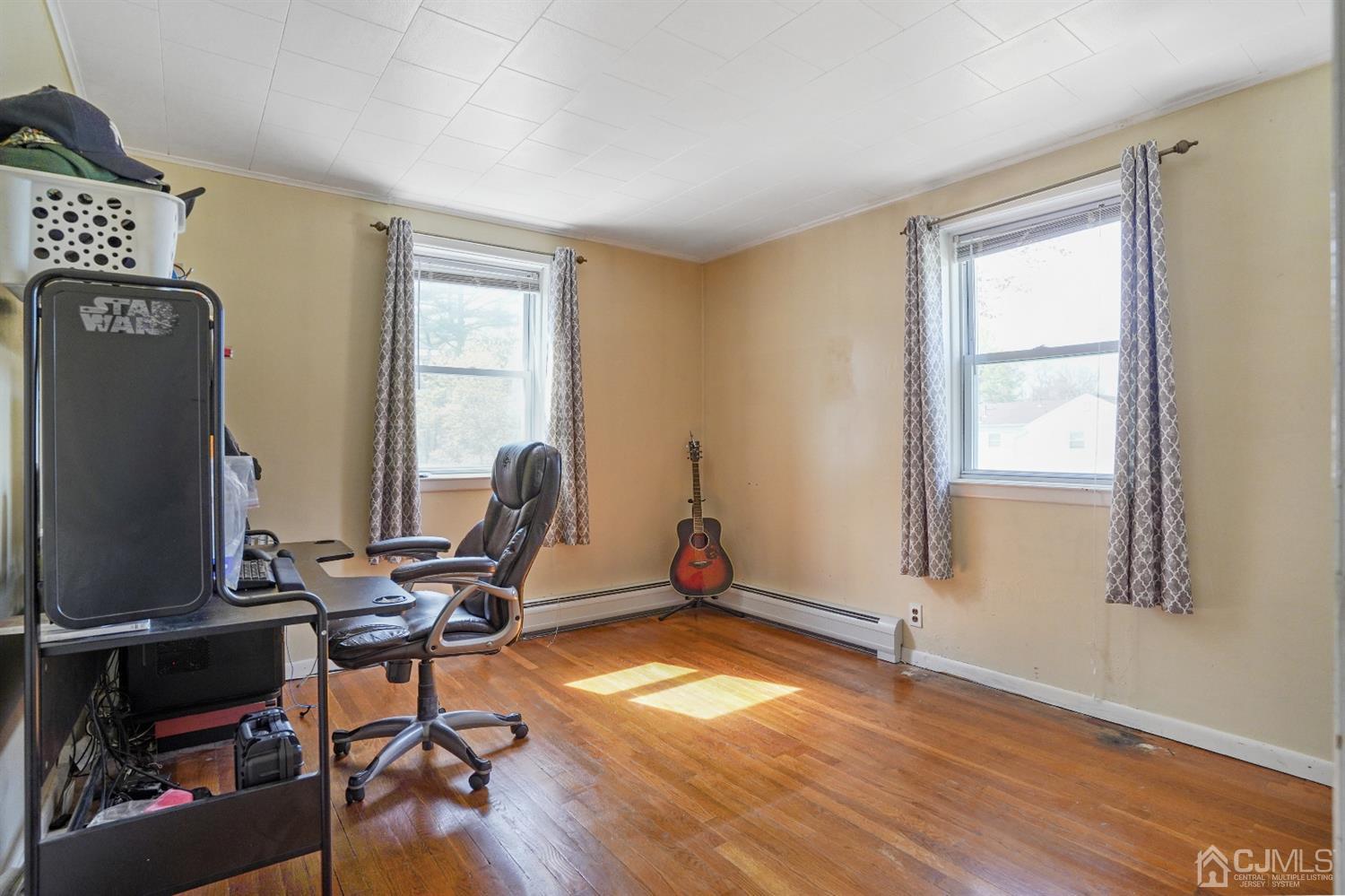 62 Oxford Road Colonia, NJ 07067 - Photo 6 of 10 a view of a workspace with furniture and a window