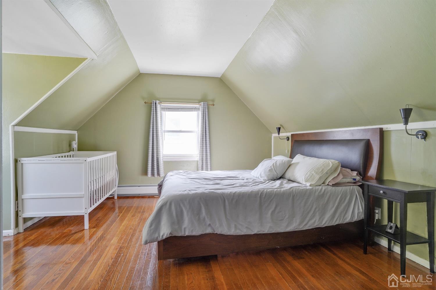 62 Oxford Road Colonia, NJ 07067 - Photo 7 of 10 a bedroom with a bed and window