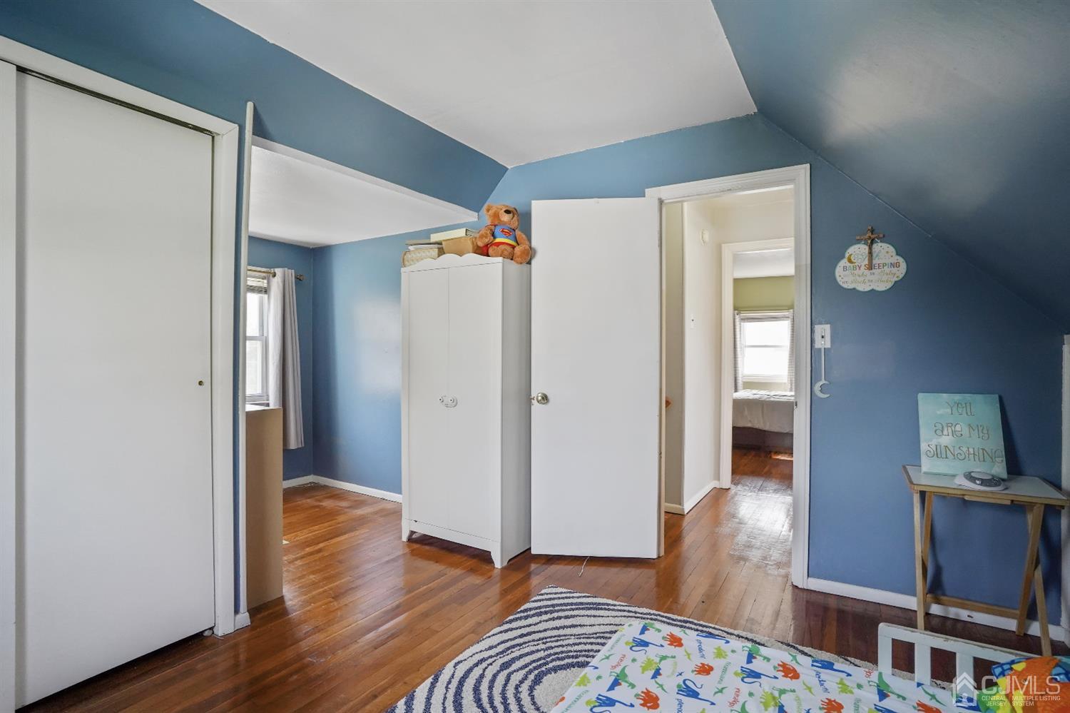 62 Oxford Road Colonia, NJ 07067 - Photo 9 of 10 a view of an empty room and wooden floor