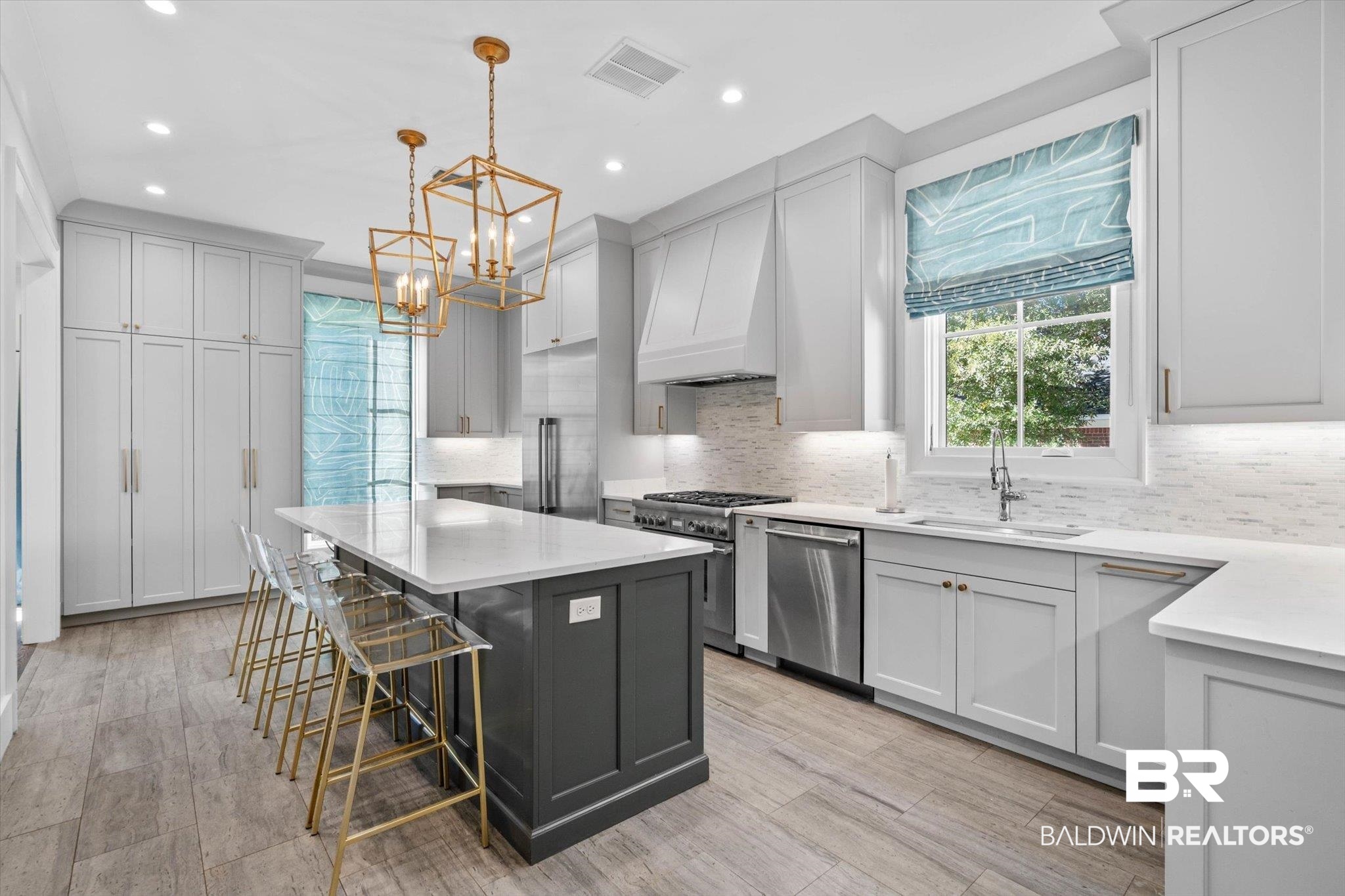 4602 Kingswood Drive Mobile, AL 36608 - Photo 12 of 45 Kitchen with tasteful backsplash, light stone countertops, gray cabinets, a kitchen breakfast bar, and pendant lighting
