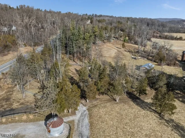 a view of a backyard with wooden fence