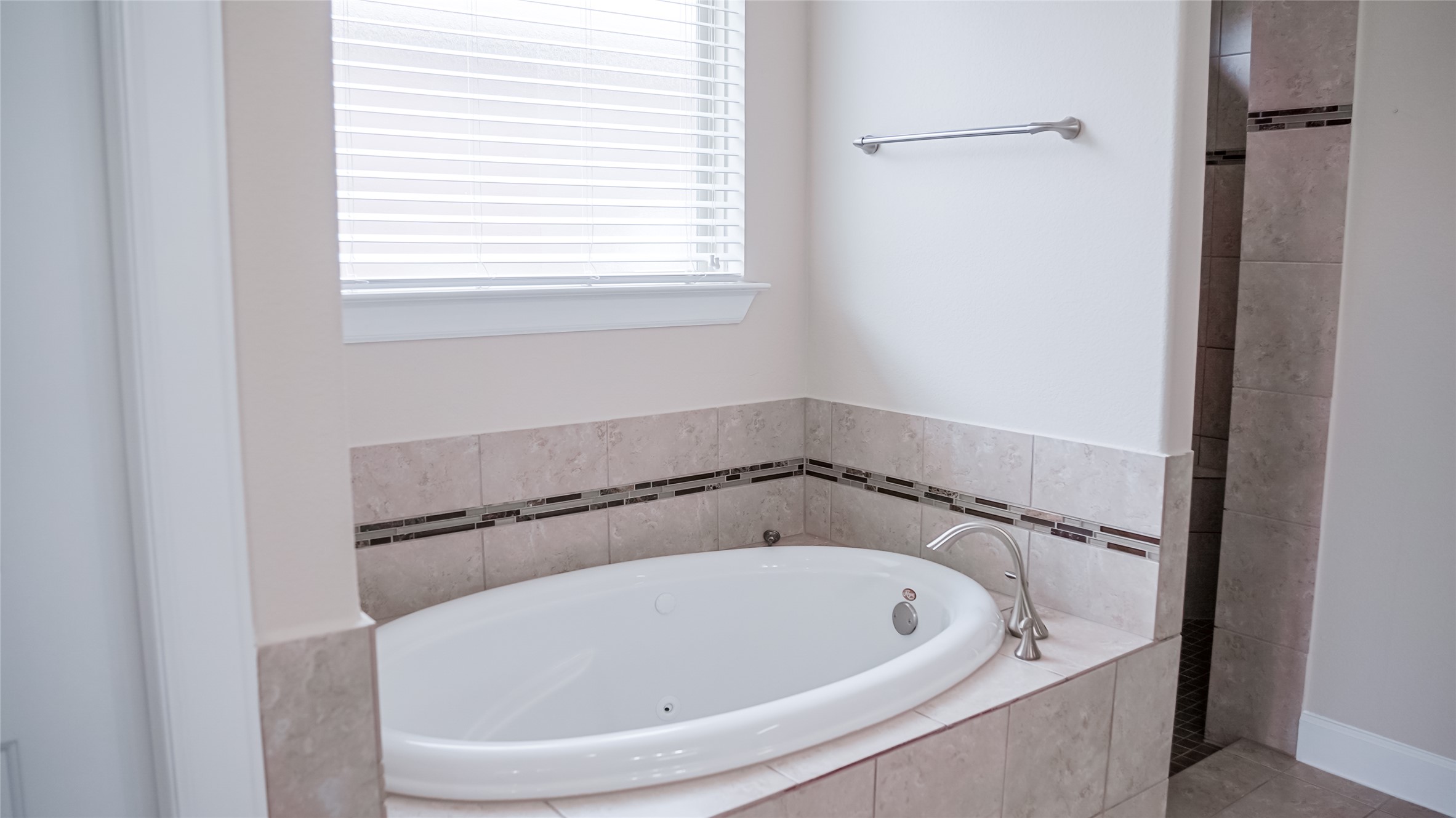 184 Fort Cobb Way Georgetown, TX 78628 - Photo 25 of 33 a white bath tub sitting in a bathroom