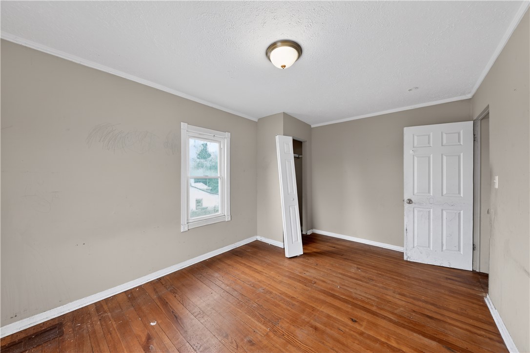 205 Rita Street Dayton, OH 45404 - Photo 16 of 34 This spacious bedroom offers abundant natural light and timeless wood flooring.