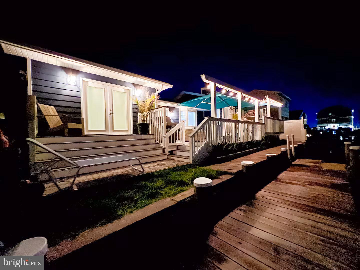 10609 Pine Needle Road Ocean City, MD 21842 - Photo 16 of 26 a view of a balcony with chairs