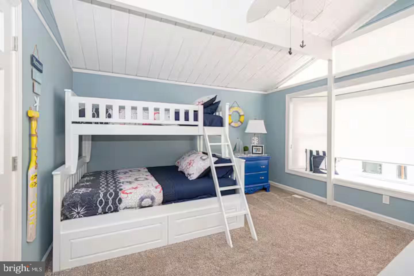 10609 Pine Needle Road Ocean City, MD 21842 - Photo 18 of 26 a bedroom with a bed and a large window