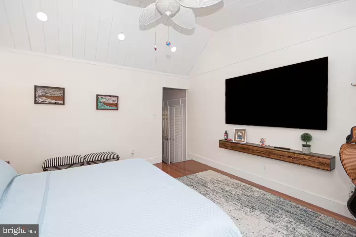 10609 Pine Needle Road Ocean City, MD 21842 - Photo 19 of 26 a bedroom with a bed and a flat screen tv