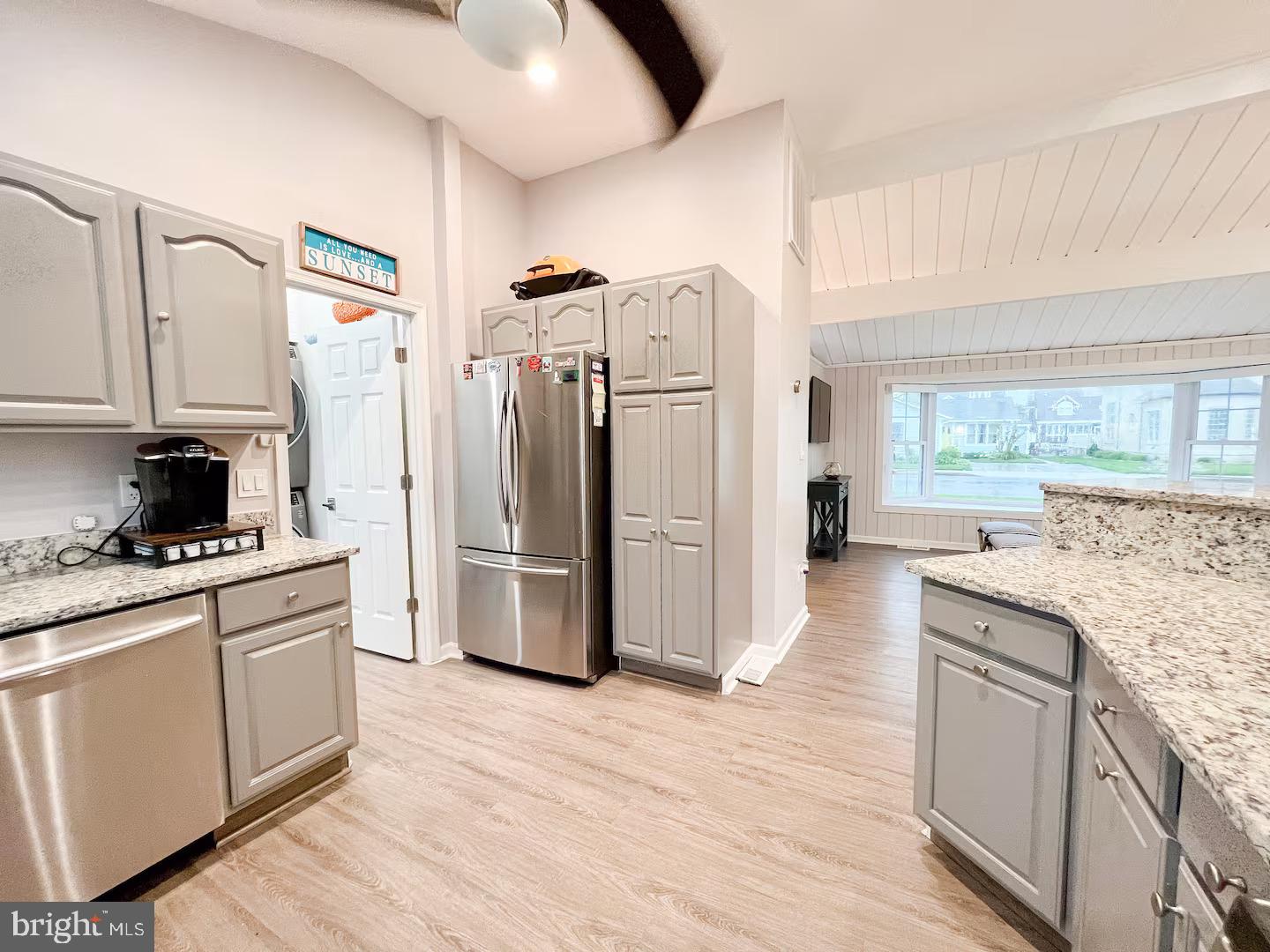 10609 Pine Needle Road Ocean City, MD 21842 - Photo 21 of 26 a kitchen with stainless steel appliances granite countertop a refrigerator and a stove top oven