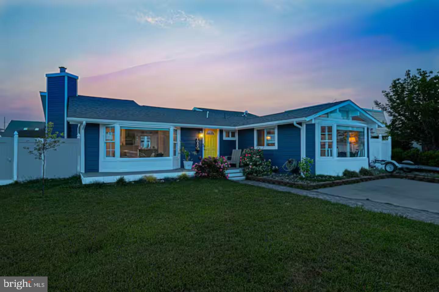 10609 Pine Needle Road Ocean City, MD 21842 - Photo 25 of 26 a front view of a house with a garden